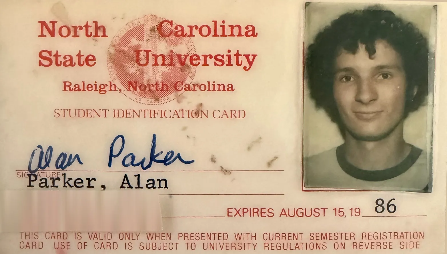 Alan Parker's North Carolina State University student identification card, with his photograph, signature, and printed name 'Parker, Alan'
